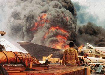 Navy crewmen try to put out a fire aboard the USS Forrestal in the Tonkin Gulf, off the coast of Vietnam, on July 29, 1967.